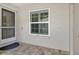 Inviting front entrance with brick pavers, screen door, and decorative window at 3950 Oakley Greene # 36, Sarasota, FL 34235