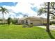 Lovely single-story home with a well-manicured lawn, lush landscaping, and a two-car garage at 3950 Oakley Greene # 36, Sarasota, FL 34235