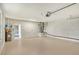 Spacious two-car garage featuring updated garage door and ample natural light at 3950 Oakley Greene # 36, Sarasota, FL 34235
