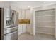 Bright and open kitchen with stainless steel appliances, white cabinets and granite countertops at 3950 Oakley Greene # 36, Sarasota, FL 34235