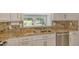 Open eat-in kitchen featuring stainless steel appliances, granite counters, and lots of natural light at 3950 Oakley Greene # 36, Sarasota, FL 34235