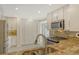 Modern kitchen featuring granite countertops, stainless steel appliances, and ample storage space at 3950 Oakley Greene # 36, Sarasota, FL 34235