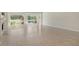 Bright living room with large windows offering scenic views and neutral tile flooring throughout at 3950 Oakley Greene # 36, Sarasota, FL 34235