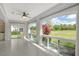 Sun-drenched living room boasts tile floors, recessed lights, and expansive windows with picturesque views at 3950 Oakley Greene # 36, Sarasota, FL 34235