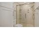 Updated bathroom featuring a walk-in shower with glass doors and modern fixtures at 3950 Oakley Greene # 36, Sarasota, FL 34235