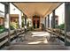 Inviting walkway to the entrance adorned with plants and benches to relax and enjoy the scenery at 3950 Oakley Greene # 36, Sarasota, FL 34235