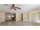 Open-concept living room featuring tile flooring and access to the kitchen at 408 Clark Ln, Holmes Beach, FL 34217