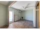 Unfinished living space with tile flooring, a ceiling fan, window and a sliding glass door at 408 Clark Ln, Holmes Beach, FL 34217