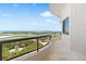 The spacious balcony overlooks a golf course, with city views in the distance at 435 L Ambiance Dr # H902, Longboat Key, FL 34228