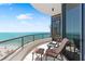 Cozy balcony with comfortable seating and unobstructed ocean views at 435 L Ambiance Dr # H902, Longboat Key, FL 34228