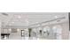 Bright and spacious ballroom with elegant lighting, arched windows, and hardwood floors offers a versatile event space at 435 L Ambiance Dr # H902, Longboat Key, FL 34228
