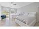 Bright bedroom features two beds, tile floors and large, arched windows at 435 L Ambiance Dr # H902, Longboat Key, FL 34228