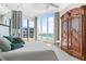Serene bedroom with large windows showcasing ocean views at 435 L Ambiance Dr # H902, Longboat Key, FL 34228