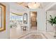 Elegant foyer with marble floors, decorative lighting, and access to living areas at 435 L Ambiance Dr # H902, Longboat Key, FL 34228