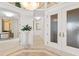 Elegant foyer with decorative tile flooring and sophisticated decor at 435 L Ambiance Dr # H902, Longboat Key, FL 34228