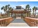 Covered wooden gazebo on a wooden boardwalk overlooking a relaxing scenery at 435 L Ambiance Dr # H902, Longboat Key, FL 34228