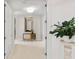Hallway with console table and decorative plant at 435 L Ambiance Dr # H902, Longboat Key, FL 34228