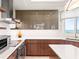 Modern kitchen featuring stainless steel appliances, sleek cabinets, and ocean view at 435 L Ambiance Dr # H902, Longboat Key, FL 34228