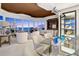 Spacious living area with lots of seating, neutral tones, and lots of windows offering an ocean view at 435 L Ambiance Dr # H902, Longboat Key, FL 34228
