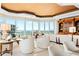 Bright living room with floor-to-ceiling windows offering scenic ocean views at 435 L Ambiance Dr # H902, Longboat Key, FL 34228