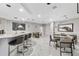 Modern lounge area features a bar, seating, and modern decor at 435 L Ambiance Dr # H902, Longboat Key, FL 34228
