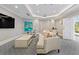 Cozy lounge area with comfortable sofa, TV, and small table at 435 L Ambiance Dr # H902, Longboat Key, FL 34228
