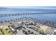 Lively waterfront restaurant with palm trees along the beach with a bridge, offering a scenic dining experience at 435 La Sila Ct, Punta Gorda, FL 33950