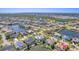 Expansive aerial shot showcasing a beautiful waterfront community with numerous canals and luxurious homes on a sunny day at 435 La Sila Ct, Punta Gorda, FL 33950