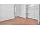 Bright bedroom with hardwood floors and an adjacent closet at 435 La Sila Ct, Punta Gorda, FL 33950