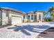 Well-maintained home showcasing a circular driveway, ample parking space, and an attached garage, surrounded by lush landscaping at 435 La Sila Ct, Punta Gorda, FL 33950