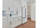 Kitchen featuring custom cabinets, quartz countertops, and stainless steel appliances at 435 La Sila Ct, Punta Gorda, FL 33950
