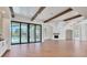 Expansive living space with beamed ceilings, hardwood floors, and seamless access to outdoor living at 435 La Sila Ct, Punta Gorda, FL 33950
