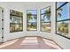 Sun-filled living room featuring black framed windows and beautiful outdoor views at 435 La Sila Ct, Punta Gorda, FL 33950