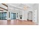 Living room showcasing wood floors, fireplace, sliding glass doors to the pool, and coffered ceilings at 435 La Sila Ct, Punta Gorda, FL 33950