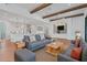 Inviting living room with beamed ceilings, hardwood floors, and an open concept design at 435 La Sila Ct, Punta Gorda, FL 33950