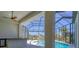 The screened-in lanai provides scenic views from the pool, which is situated on a waterfront canal at 435 La Sila Ct, Punta Gorda, FL 33950