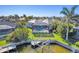 A beautiful waterfront home with a screened-in pool, boat lift, and lush tropical landscaping at 435 La Sila Ct, Punta Gorda, FL 33950