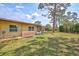 Serene backyard setting featuring lush greenery and a screened patio, perfect for enjoying outdoor living at 4420 Tecumseh Trl # 38, Sarasota, FL 34233