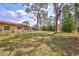 Expansive backyard with mature trees, offering plenty of space for recreation and relaxation at 4420 Tecumseh Trl # 38, Sarasota, FL 34233