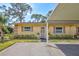 Charming single-story home with a well-manicured front yard and covered carport at 4420 Tecumseh Trl # 38, Sarasota, FL 34233