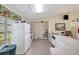 Well-equipped kitchen features a refrigerator, oven, sink, and ample counter space at 4420 Tecumseh Trl # 38, Sarasota, FL 34233