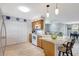 Spacious kitchen with a center island, modern appliances, and ample cabinet storage at 4420 Tecumseh Trl # 38, Sarasota, FL 34233