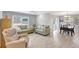 Open-concept living room with a comfortable seating area and seamless access to the dining space at 4420 Tecumseh Trl # 38, Sarasota, FL 34233