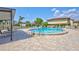 Community pool with lounge chairs and tables, perfect for relaxation and enjoying sunny days at 4420 Tecumseh Trl # 38, Sarasota, FL 34233
