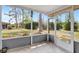 Relaxing screened patio featuring tile flooring and views of the lush backyard and mature trees at 4420 Tecumseh Trl # 38, Sarasota, FL 34233