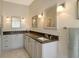 Bathroom with double sink vanity and neutral color palette at 4444 Highland Oaks Cir, Sarasota, FL 34235