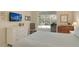 Bedroom with slider to the lanai and pool at 4444 Highland Oaks Cir, Sarasota, FL 34235