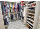 Walk-in closet with ample storage for clothing, shoes and accessories at 4444 Highland Oaks Cir, Sarasota, FL 34235