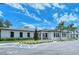 Beautiful community clubhouse showcasing manicured landscaping, modern architectural design and convenient parking at 4444 Highland Oaks Cir, Sarasota, FL 34235