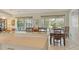 Open dining area with countertop seating and a view to the backyard patio, creates a seamless flow for entertaining at 4444 Highland Oaks Cir, Sarasota, FL 34235